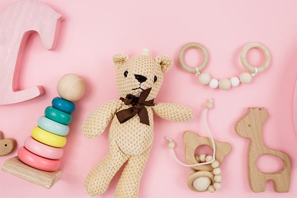 Baby toys on a pink background